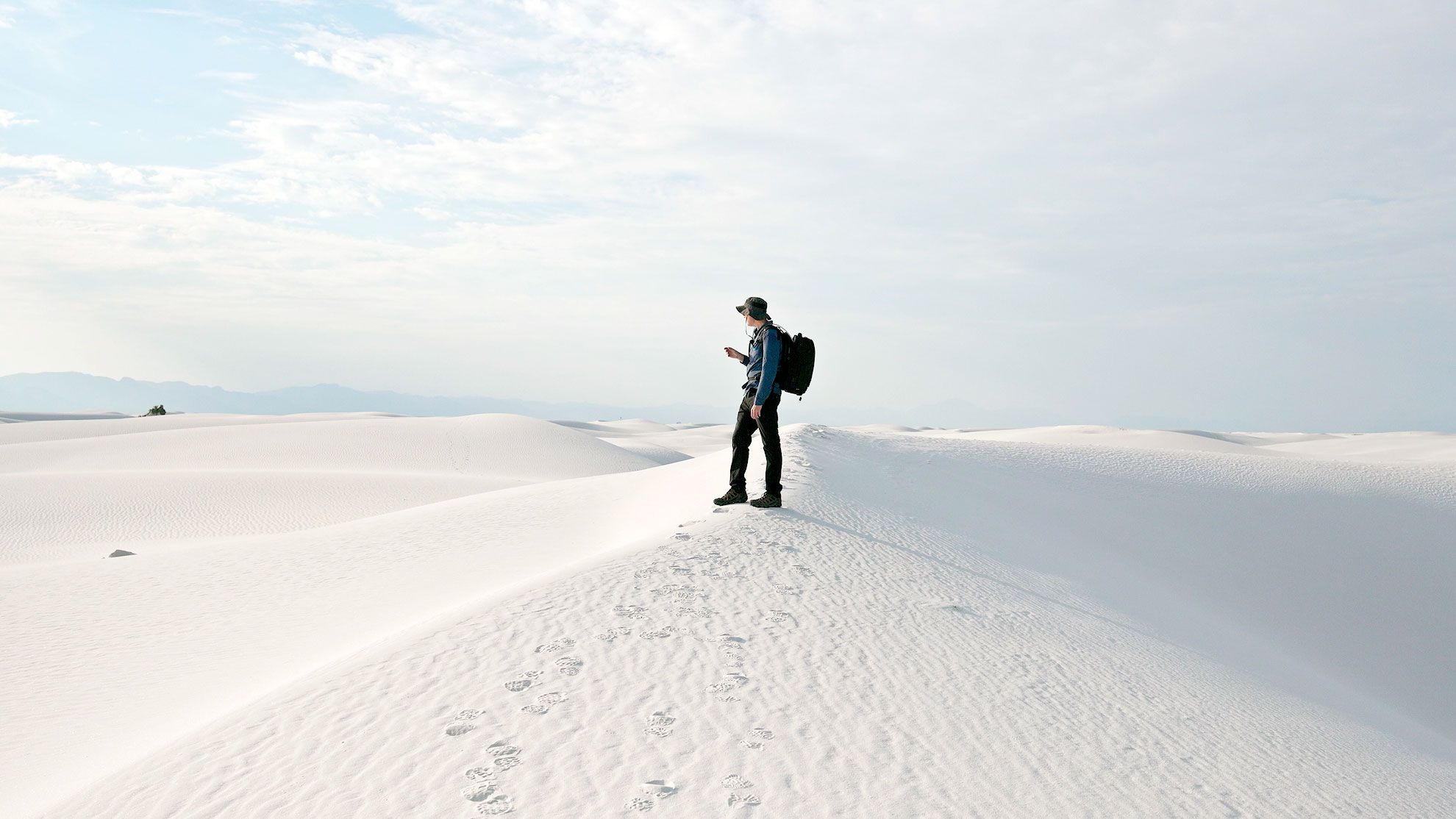 Hiking with camera bag in White Sands